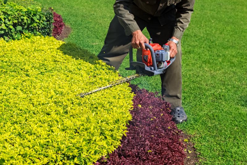 Landscaper Using Shears